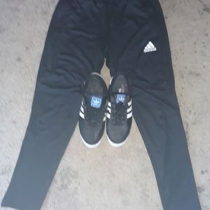 set of Adidas track pants and samoas